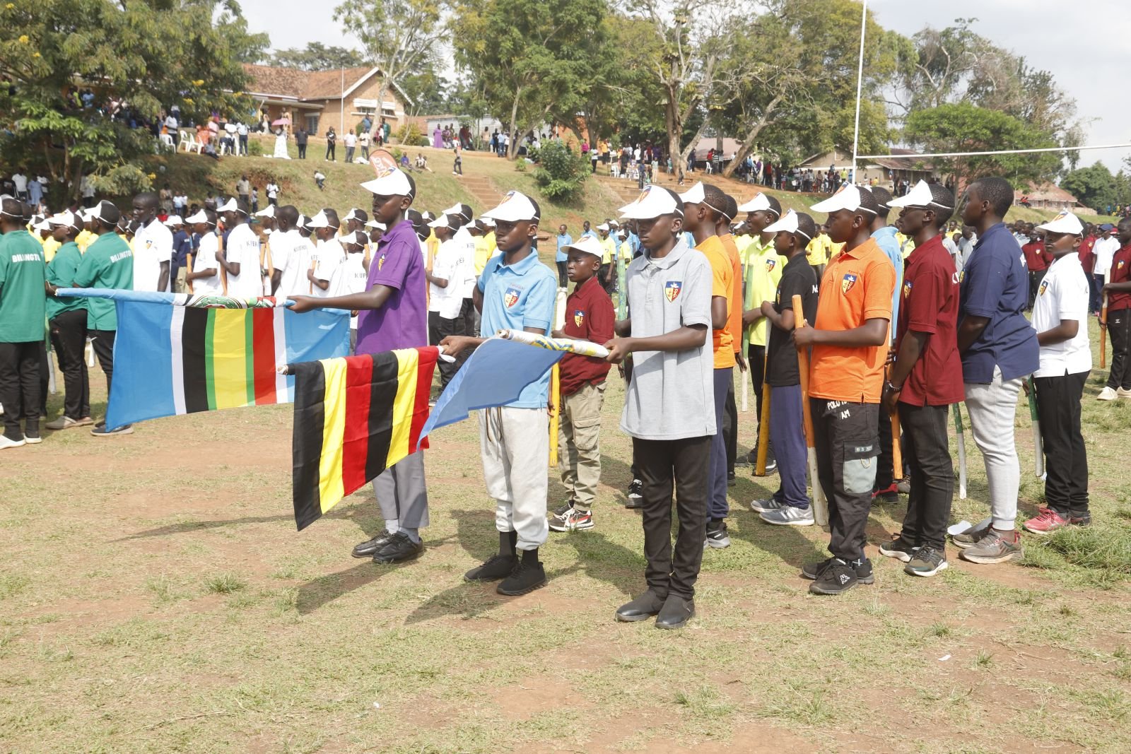 Flag bearers lead the march past